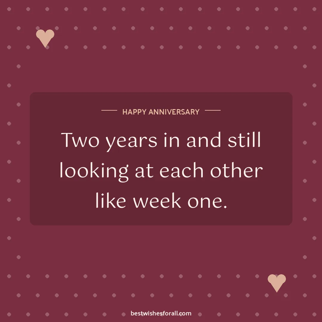 Milestone anniversary wishes image: Two years in and still looking at each other like week one.